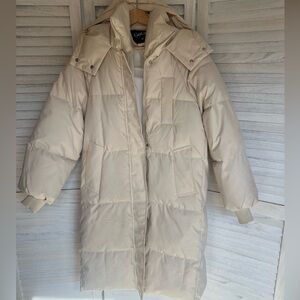 Nude puffer trenchcoat
